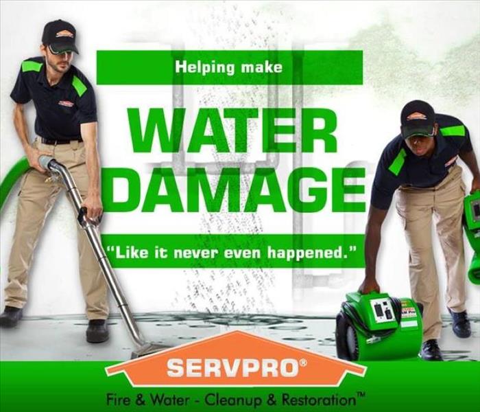 Two SERVPRO technicians are shown taking care of water damage and the words helping make it "Like it never even happened."